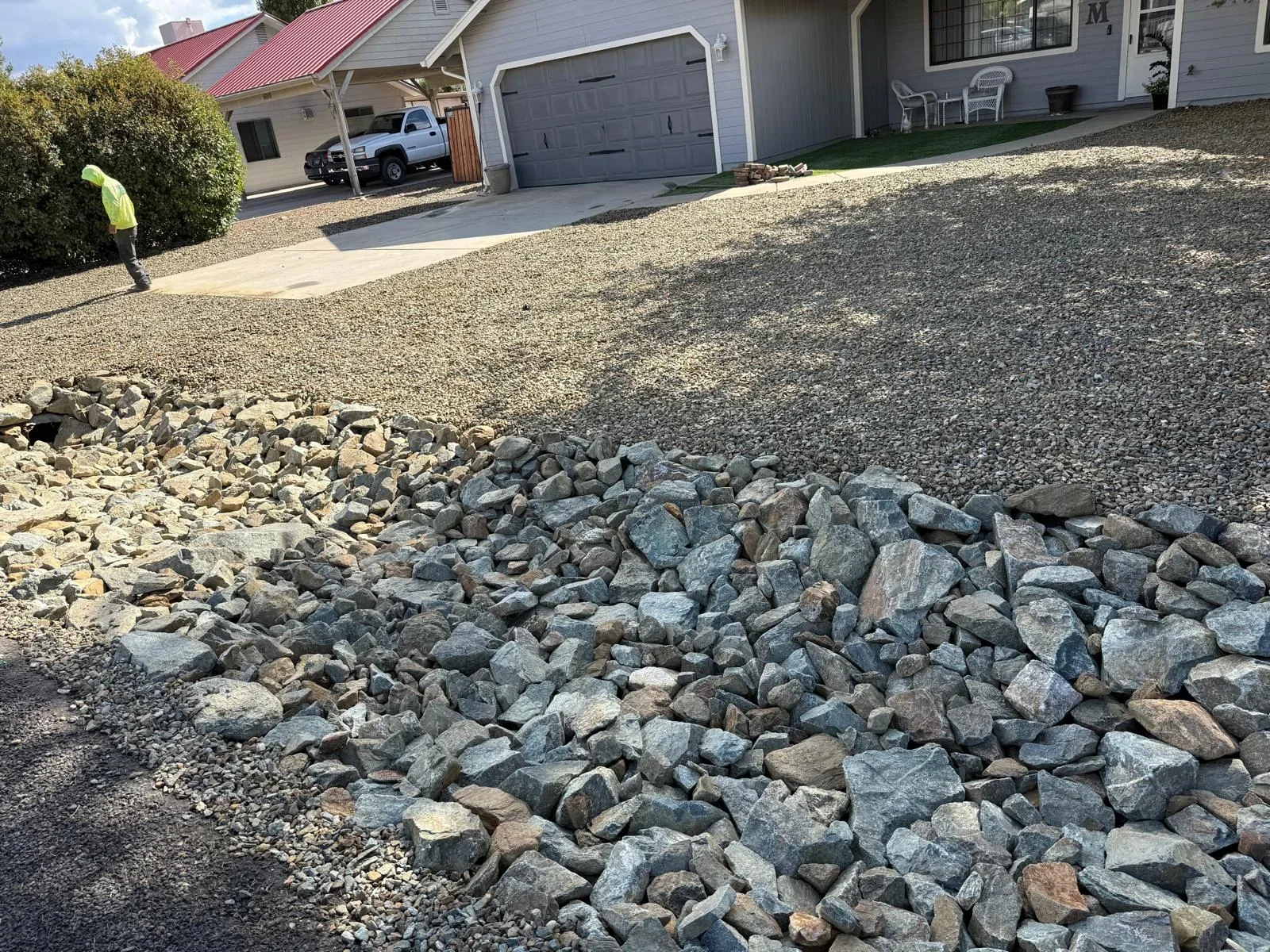 Residential driveway with crushed granite and decorative rock edging in Prescott Valley